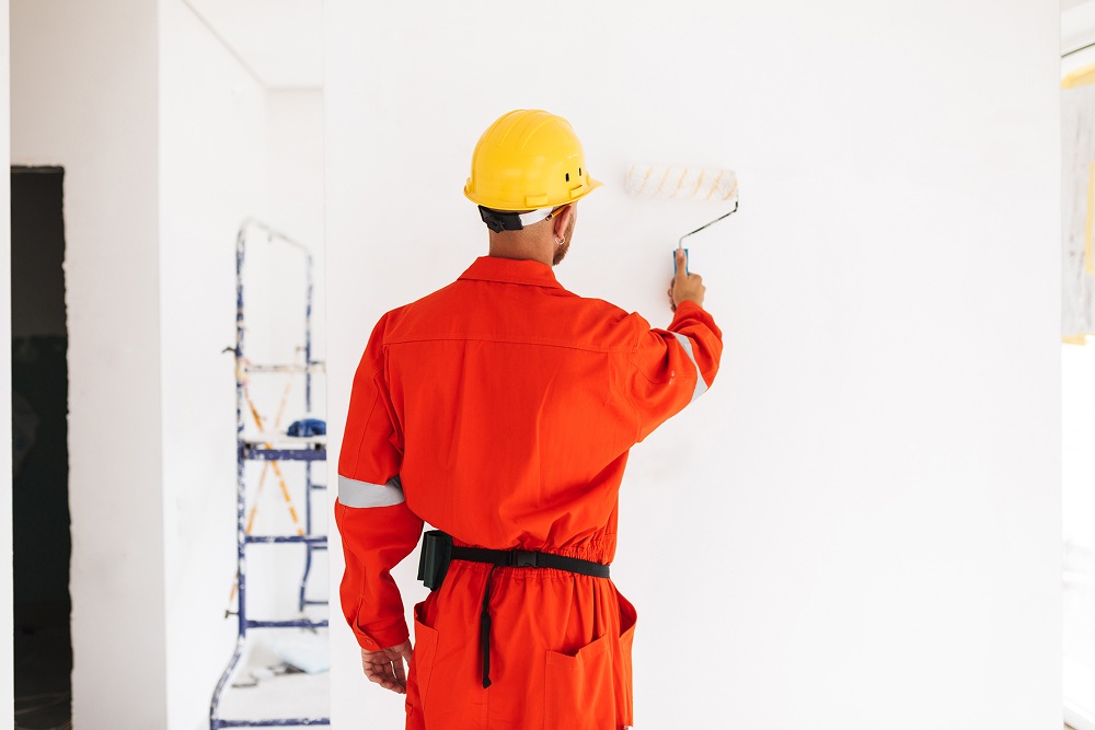 A professional painter painting the interior walls