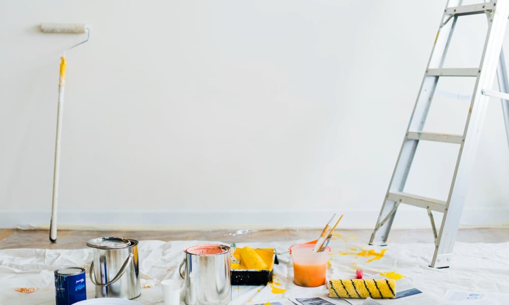Painting supplies in empty room