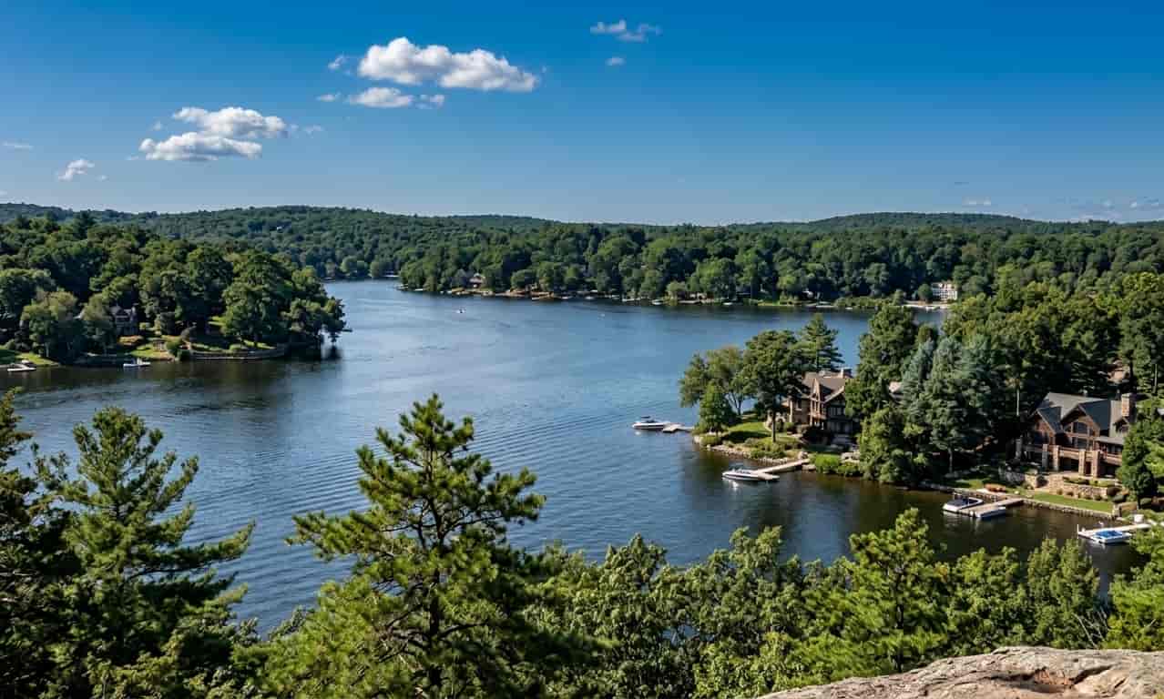 orientation view of a scenic lake surrounded by dense green forests