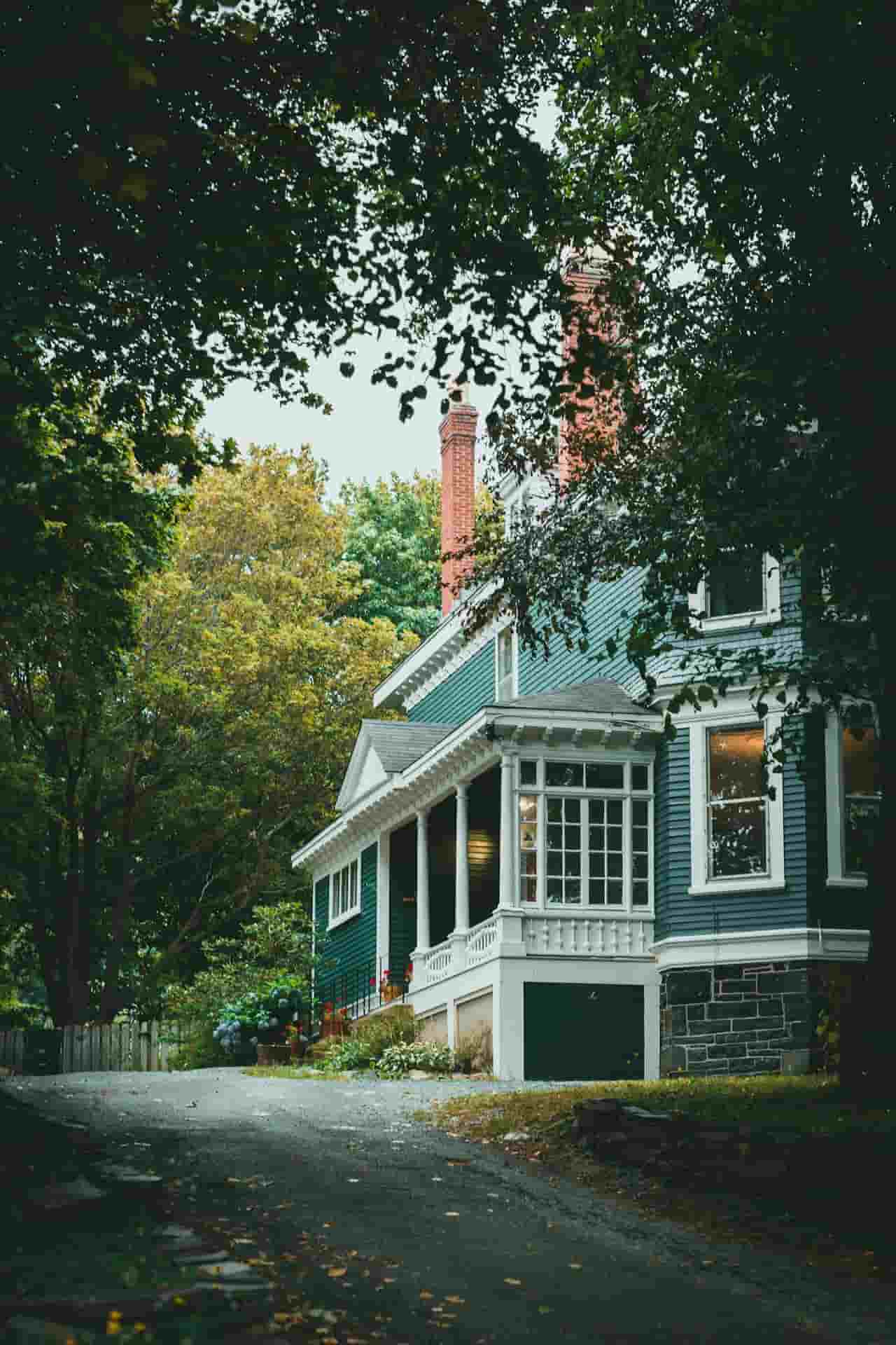 traditional two-story home with blue horizontal siding