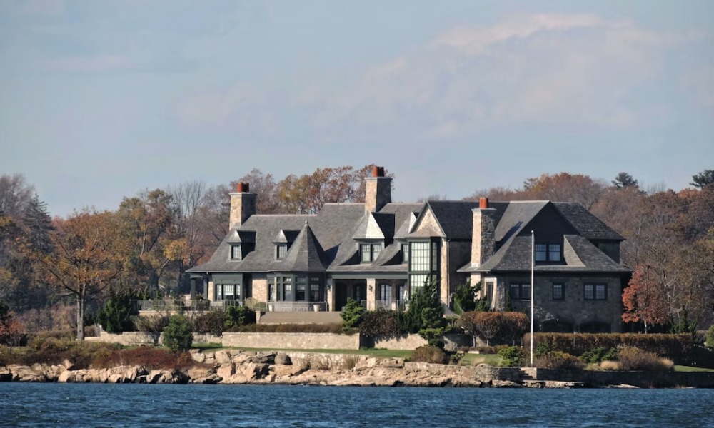A large waterfront stone mansion