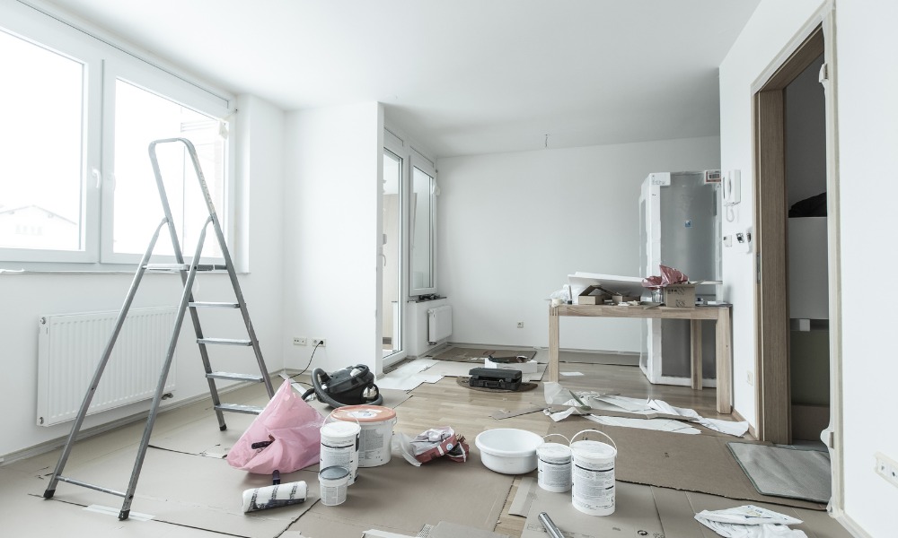 An empty room under renovation with paint cans