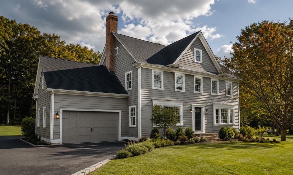 Two-story grey house with white trim