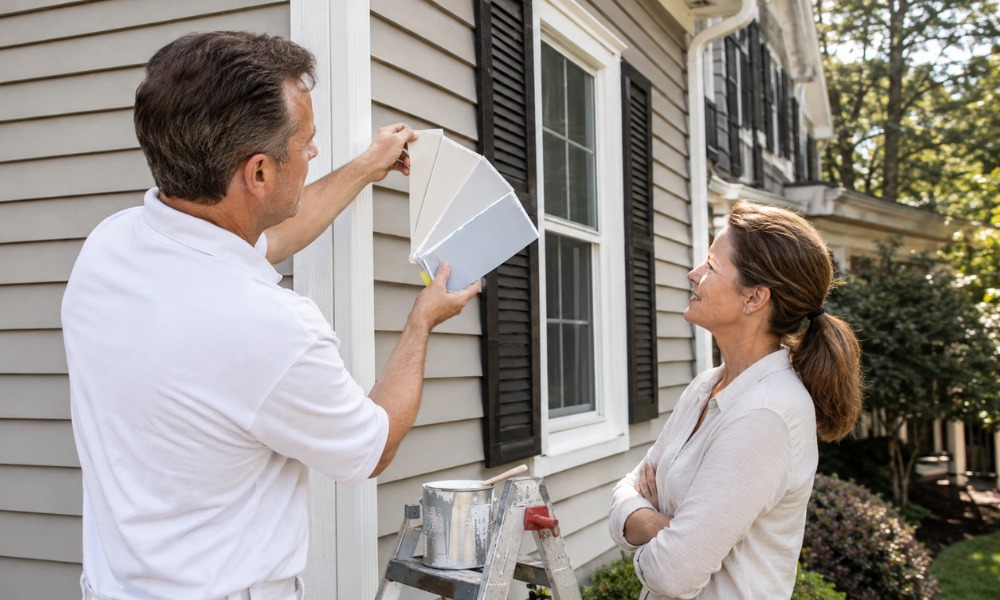 Contractor showing a color fan deck to a homeowner